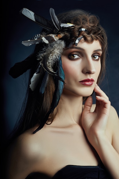 Premium Photo | Indian woman with feathers in her hair, portrait of ...