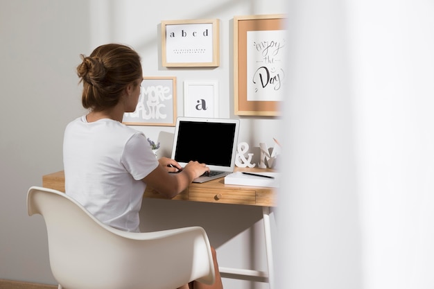 Best Laptop Working From Home Individual working from home on laptop | Free Photo