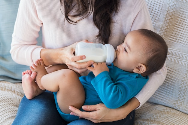 premium-photo-infant-drinking-milk