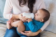 Premium Photo Infant Drinking Milk