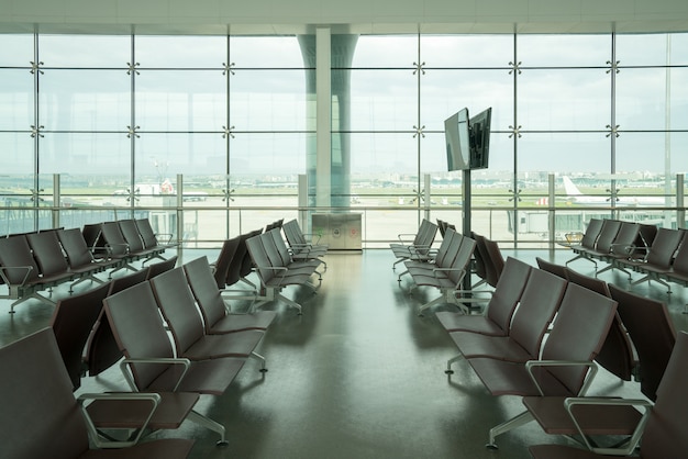 Premium Photo | Inside airport - airport seating in big airport