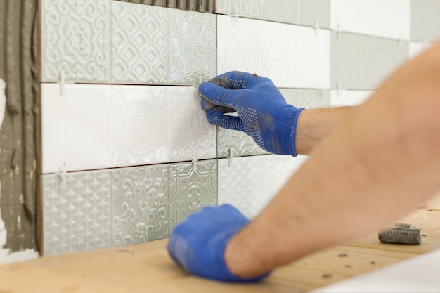installing ceramic tile on wall in kitchen