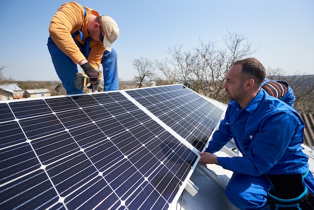 Premium Photo | Installing solar photovoltaic panel system on roof of house