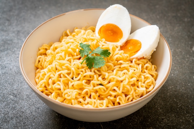 Premium Photo | Instant noodles with salt egg