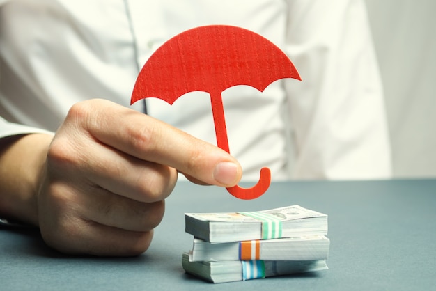 Download Free An Insurance Agent Holds A Red Umbrella Premium Photo Use our free logo maker to create a logo and build your brand. Put your logo on business cards, promotional products, or your website for brand visibility.