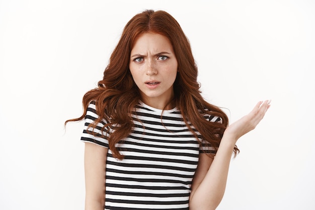 Premium Photo Intense And Confused Outraged Pissed Young Redhead Girl In Striped T Shirt 5807