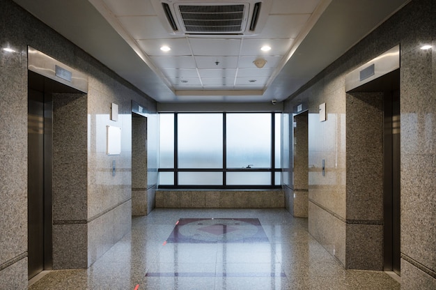  Interior of closed marble elevator hall in the office