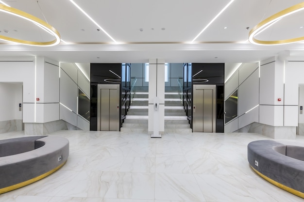  Interior contemporary corridor hall business center in white tiles with marble
