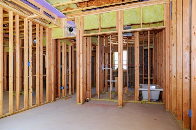 Premium Photo Interior Wall Framing With Piping Installation In The Basement Bathroom Remodel Under Floor Plumbing Work - Framing Basement Walls Around Pipes