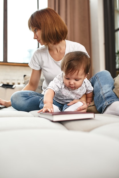 Premium Photo | Inventive Modern Mother With Children Multitasking In ...