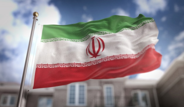 Iran flag 3d rendering on blue sky building background Premium Photo