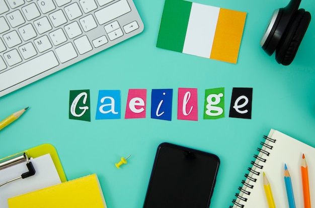 Ireland lettering next to ireland flag Free Photo