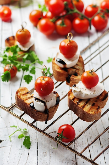 Premium Photo | Italian crostini with mozzarella and tomato