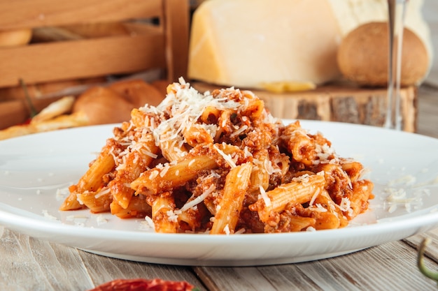 Premium Photo | Italian penne pasta bolognese beef and parmesan