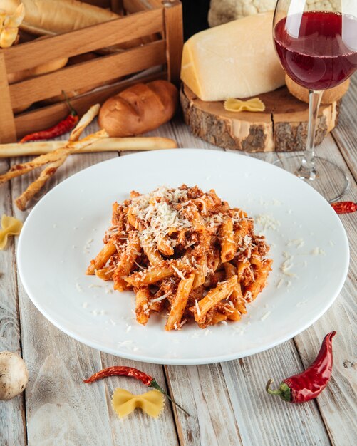 Premium Photo | Italian penne pasta bolognese beef and parmesan