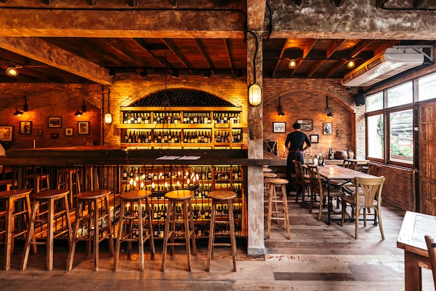 Italian restaurant decorated with brick in warm light that created cozy ...