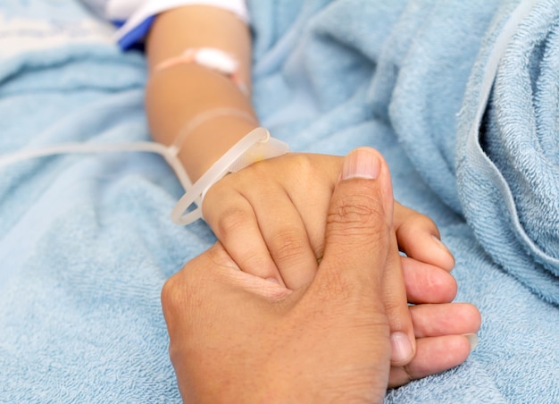 Premium Photo | Iv solution in a child's patients hand