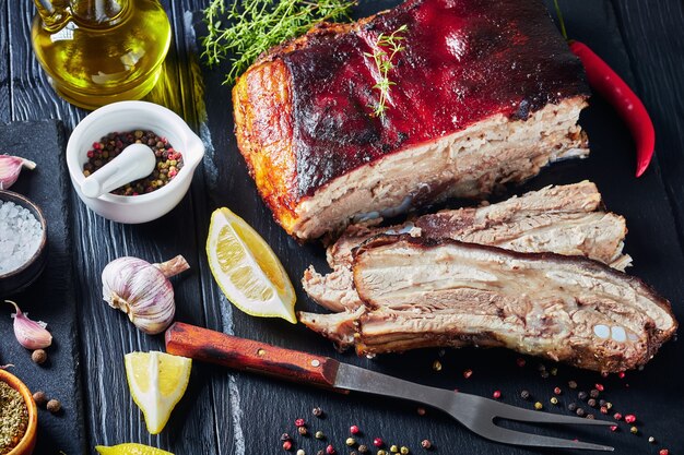 Premium Photo Jamaican Roasted Jerk Pork Belly With Crispy Skin On A Black Slate Tray With