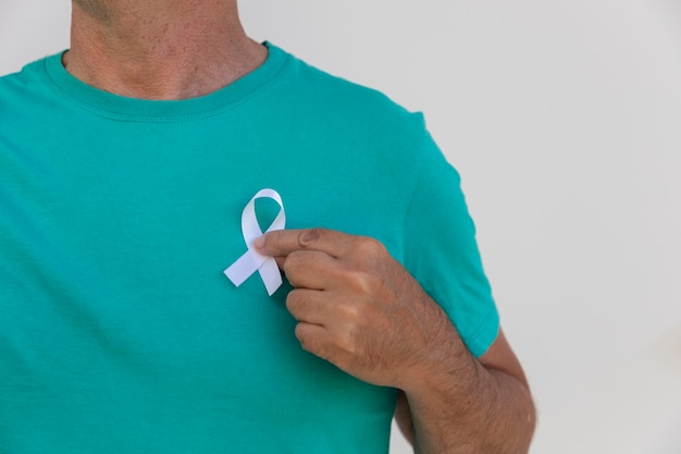 premium-photo-january-white-man-putting-white-ribbon-on-his-shirt