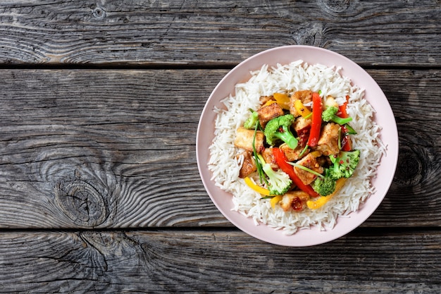 Premium Photo Japanese Dish Katsu Chicken Curry With Vegetables Broccoli Red And Yellow Sweet Pepper And Parsley Over Jasmine Rice Served On A Pink Plate On A Stone Surface Served With