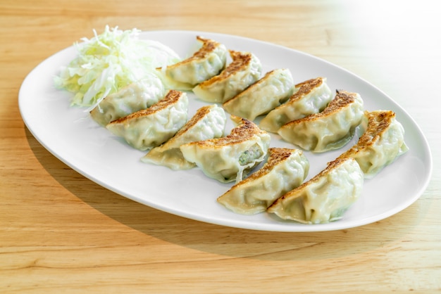 Premium Photo | Japanese gyoza or dumplings with soy sauce