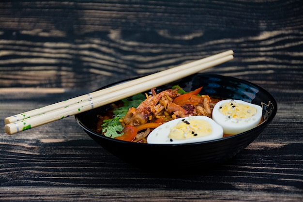 Japanese ramen with seafood, herbs and pickled eggs Premium Photo