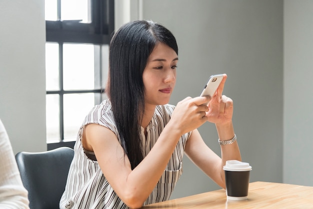 Free Photo | Japanese woman playing on her phone