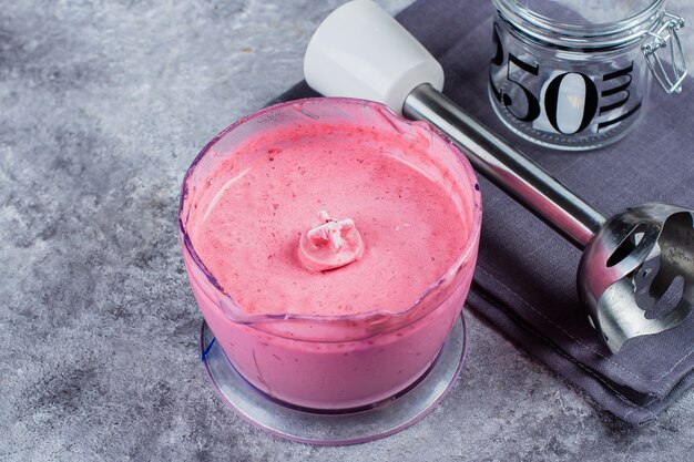 Jar with cranberry sauce on concrete table background. copy space Premium Photo