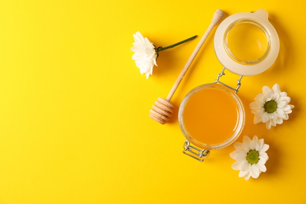 Download Premium Photo Jar With Honey Dipper And Chamomile On Yellow Background Space For Text Yellowimages Mockups