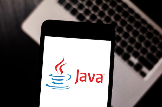 Java logo is displayed on a smartphone. Premium Photo