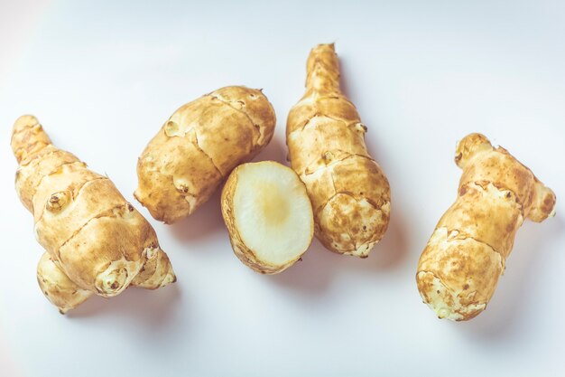 Jerusalem artichoke root on a white background. | Premium Photo