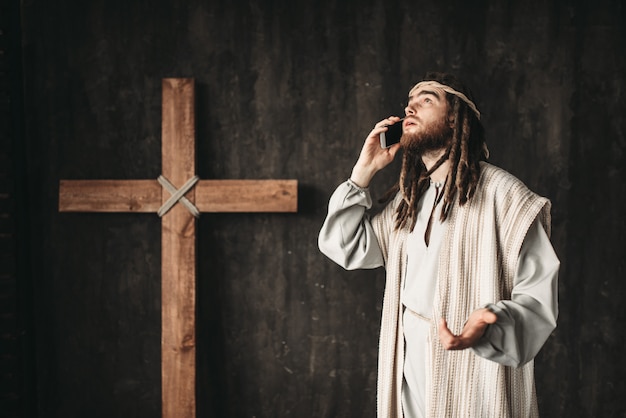 Premium Photo | Jesus christ talking to god by mobile phone ...