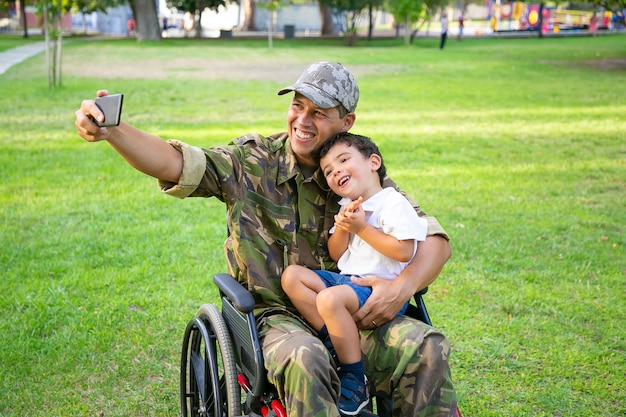 Free Photo Joyful Disabled Military Dad And His Little