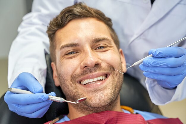 Premium Photo | Joyous patient feeling alright at dental checkup