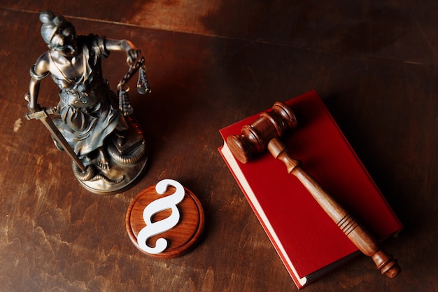 Premium Photo | Judge gavel and lady of justice in a courtroom