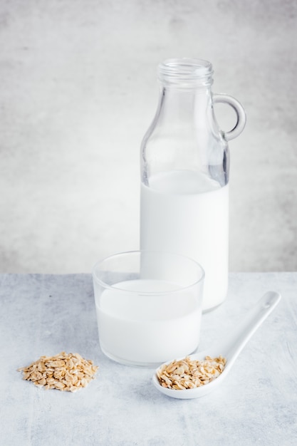 Premium Photo | Jug full of oat milk ideal for lowering cholesterol and ...