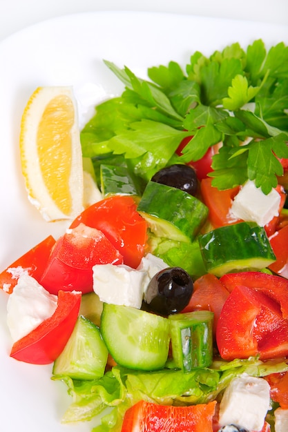 Premium Photo | Juicy fresh greek salad in white bowl