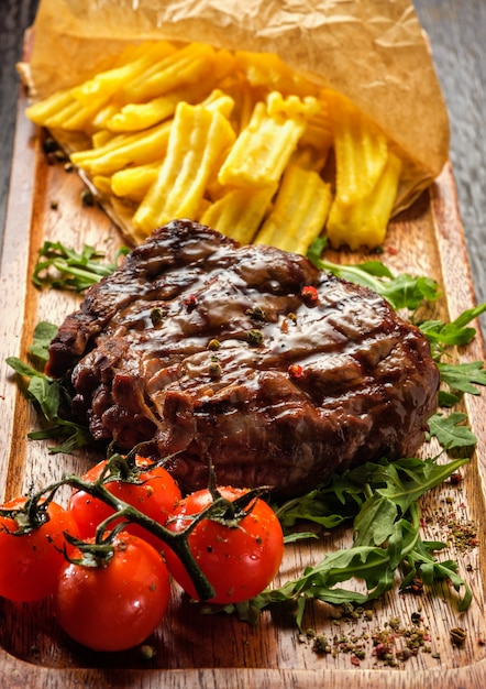 Premium Photo | Juicy tasty grilled fillet steak served with tomatoes ...