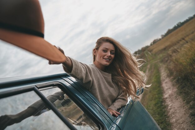 Leaning out of car