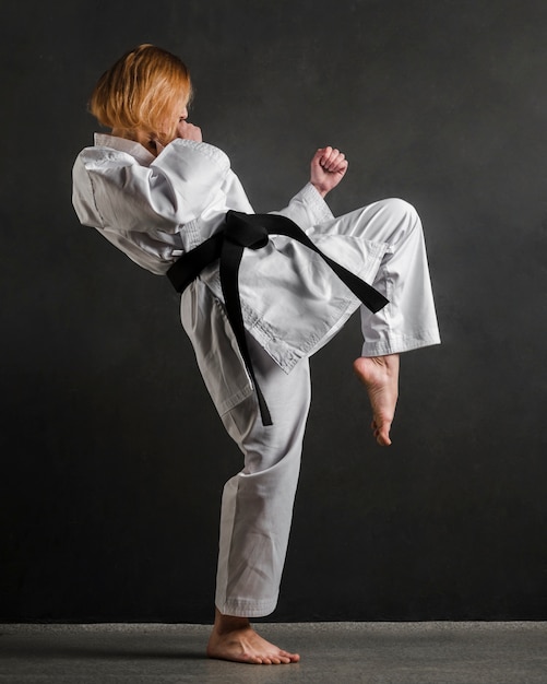 Free Photo | Karate woman practicing full shot