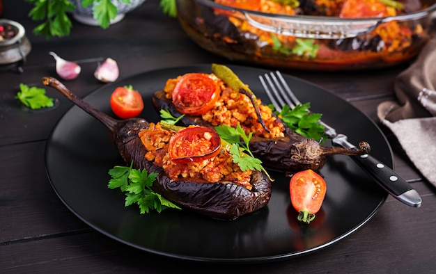 Premium Photo Karniyarik Turkish Traditional Aubergine Eggplant Meal Stuffed Eggplants With Ground Beef And Vegetables Baked With Tomato Sauce