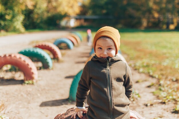 Premium Photo | Kid autumn fashion season, child in hat jacket clothing ...