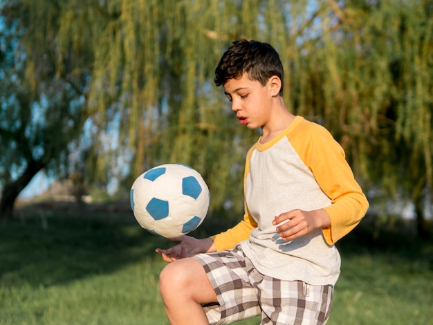 Free Photo | Kid playing with ball outdoors