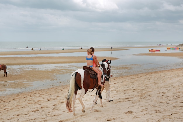 Kids Girl Rides On Horse At Beach Huahin Thailand Premium Photo