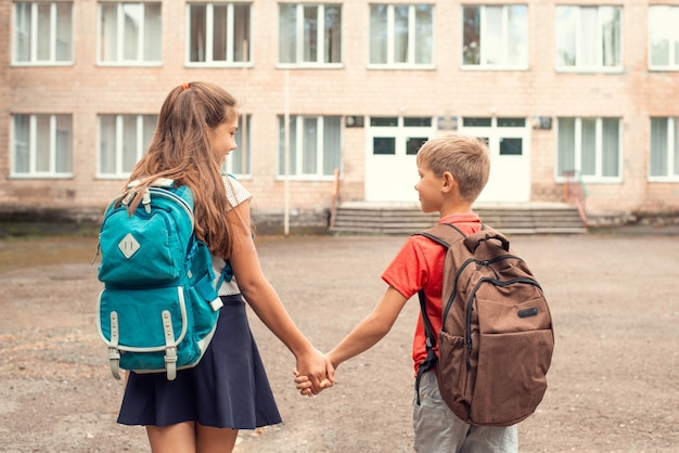 Premium Photo | Kids going to school hand in hand