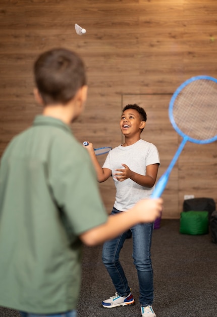 Free Photo | Kids playing badminton medium shot