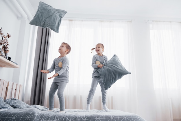 Kids Playing In Parents Bed Children Wake Up In Sunny White