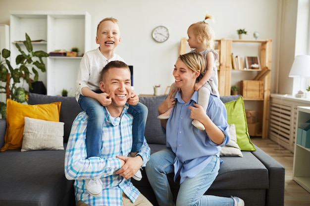 Premium Photo | Kids riding parents necks