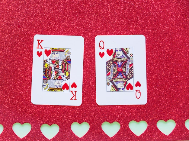 King And Queen Of Hearts Playing Cards On Paper Free Photo