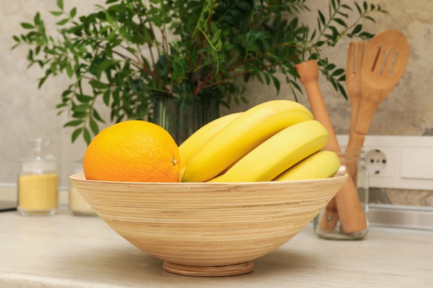 Premium Photo | Kitchen interior with supplies, fruits and plant